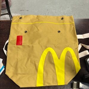 M Tan and Yellow Backpack